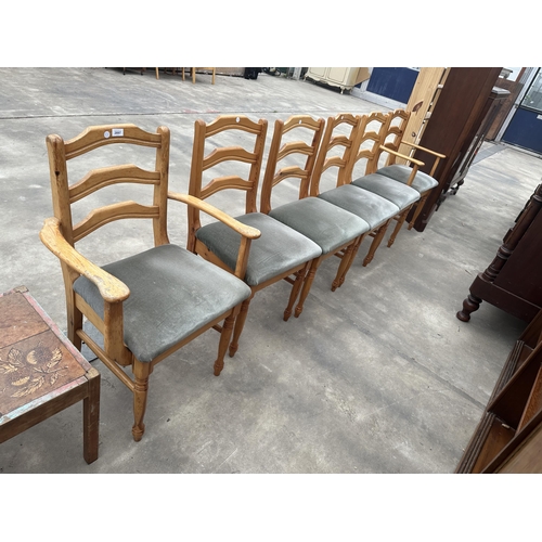 2897 - A SET OF SIX PINE DINING CHAIRS, TWO BEING CARVERS