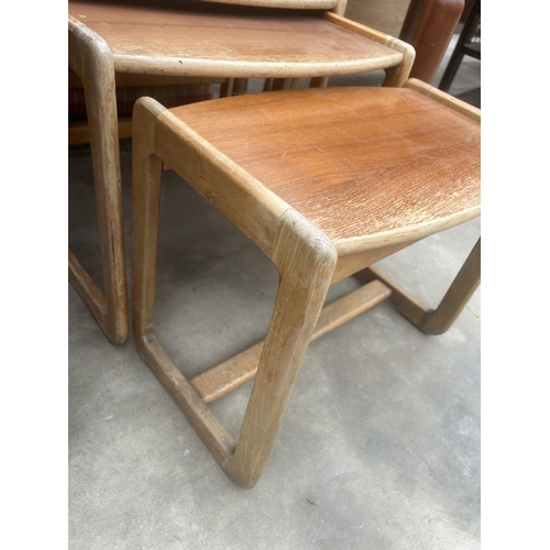 2907 - A NEST OF THREE RETRO TEAK TABLES