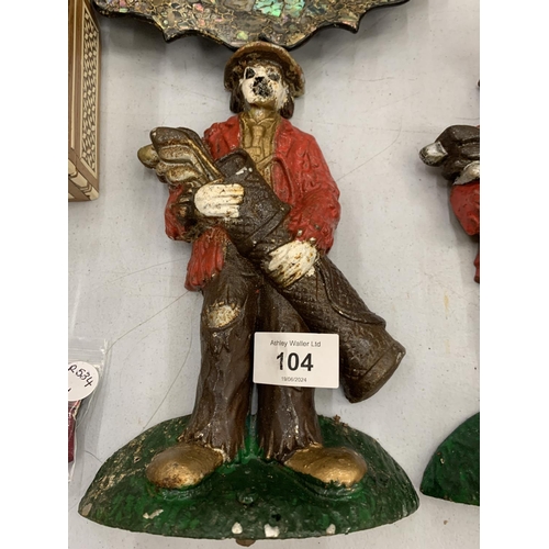 104 - A  PAIR OF GOLFING CLOWN CAST IRON DOORSTOPS