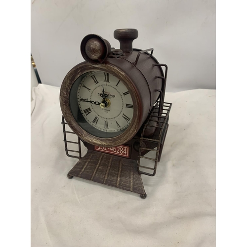 117 - A STEAM TRAIN SHAPED METAL MANTEL CLOCK WITH ROMAN NUMERALS