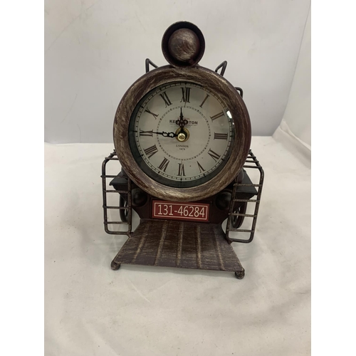 117 - A STEAM TRAIN SHAPED METAL MANTEL CLOCK WITH ROMAN NUMERALS