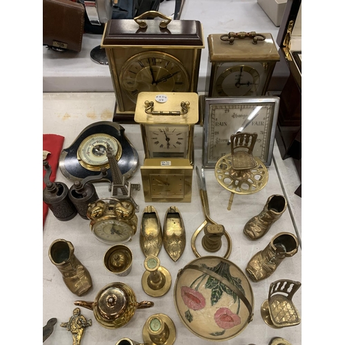 123 - A LARGE QUANTITY OF BRASS ITEMS TO INCLUDE CLOCKS, BOTTLE OPENERS, BOOTS, ETC.,