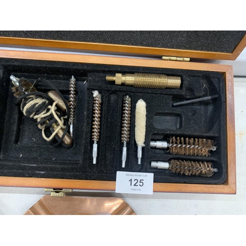 125 - A GUN CLEANING KIT IN WOODEN CASE