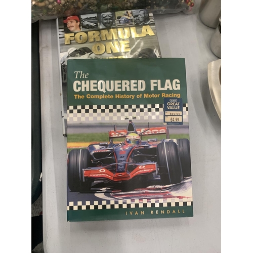 139 - THREE FORMULA ONE BOOKS TO INCLUDE A GUIDE TO THE 2002 SERIES, THE CHEQUERED FLAG THE COMPLETE HISTO... 