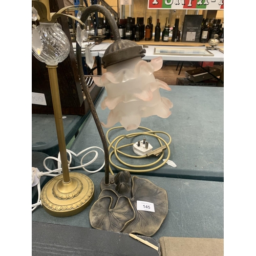 145 - A VINTAGE ART NOVEAU METAL GOOSE NECK LAMP WITH A WATER LILY BASE TOGETHER WITH A FURTHER BRASS LAMP