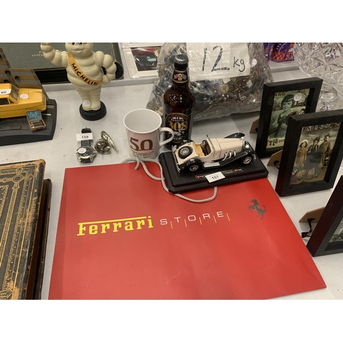 157 - A BURAGO MODEL OF A MERCEDES BENZ, FERRARI BAG, 50 YEARS OF FERRARI MUG AND A BOTTLE OF LORD HESKETH... 