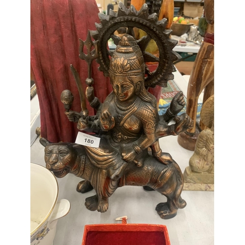 180 - A BRONZE COLOURED, EXOTIC INDIAN MOTHER GODDESS ON A TIGER'S BACK, HEIGHT 38CM, LENGTH 28CM