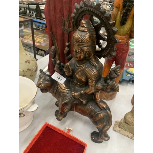 180 - A BRONZE COLOURED, EXOTIC INDIAN MOTHER GODDESS ON A TIGER'S BACK, HEIGHT 38CM, LENGTH 28CM