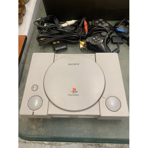 190 - A PLAYSTATION ONE CONSOLE, TWO CONTROLLERS, LEADS, THREE MEMORY CARDS, A WIRELESS GAME CONTROLLER, G... 