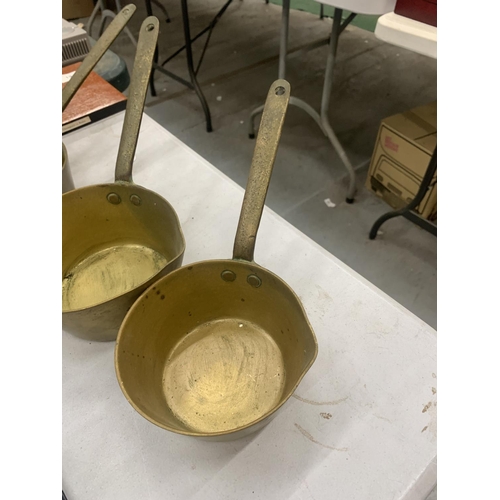 192 - THREE GRADUATED BRASS PANS