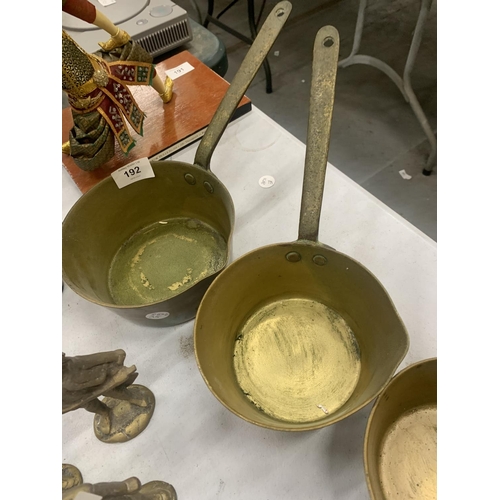 192 - THREE GRADUATED BRASS PANS