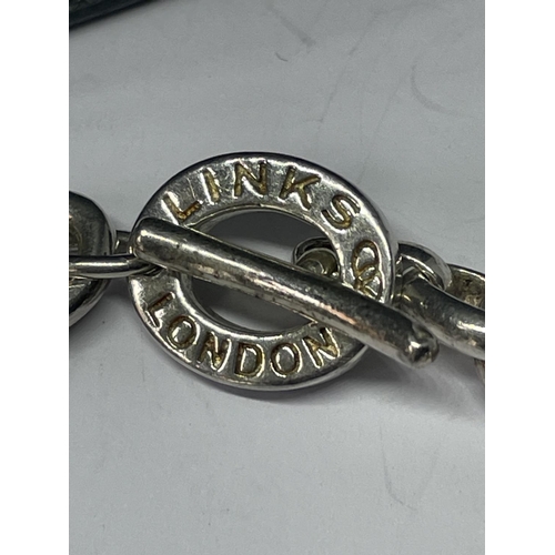 504 - A LINKS OF LONDON SILVER BRACELET WITH A HEART CHARM AND A CHARM IN A PRESENTATION BOX