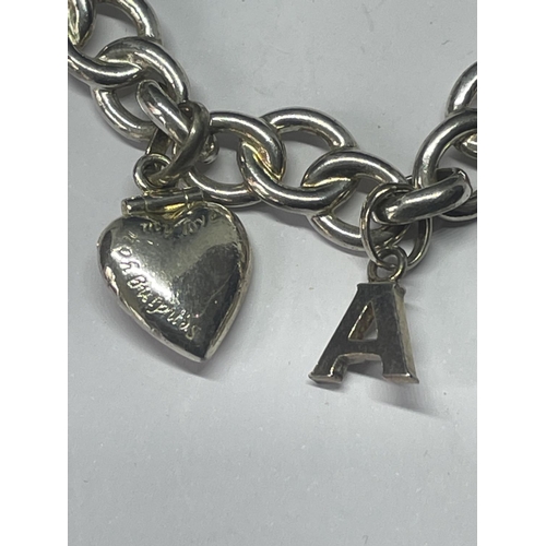 504 - A LINKS OF LONDON SILVER BRACELET WITH A HEART CHARM AND A CHARM IN A PRESENTATION BOX