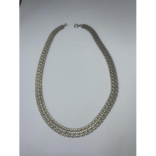 514 - A MARKED STERLING SILVER DECORATIVE NECKLACE