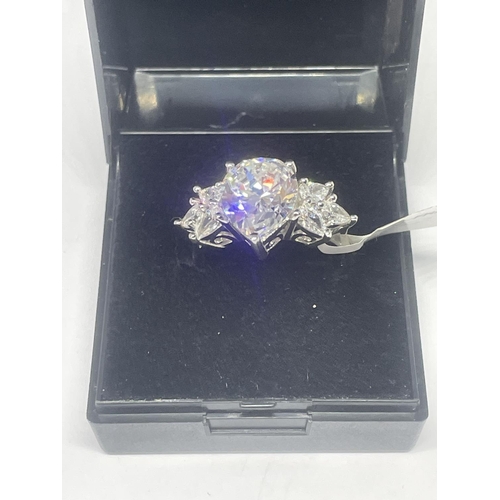 516 - A MARKED 925 SILVER RING WITH SWAROVSKI ZIRCONIAS SIZE R/S IN A PRESENTATION BOX