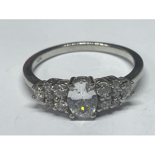 520 - A MARKED 925 SILVER RING WITH A CENTRE CLEAR STONE AND FURTHER ONES TO THE SHOULDERS SIZE R IN A PRE... 