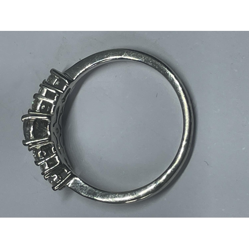 520 - A MARKED 925 SILVER RING WITH A CENTRE CLEAR STONE AND FURTHER ONES TO THE SHOULDERS SIZE R IN A PRE... 