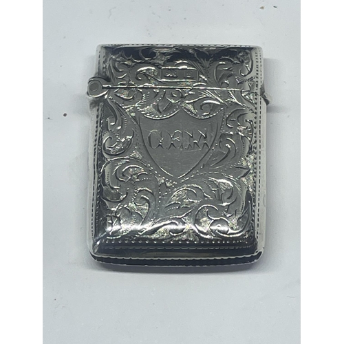 523 - A DECORATIVE HALLMARKED BIRMINGHAM SILVER VESTA CASE