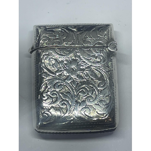 523 - A DECORATIVE HALLMARKED BIRMINGHAM SILVER VESTA CASE