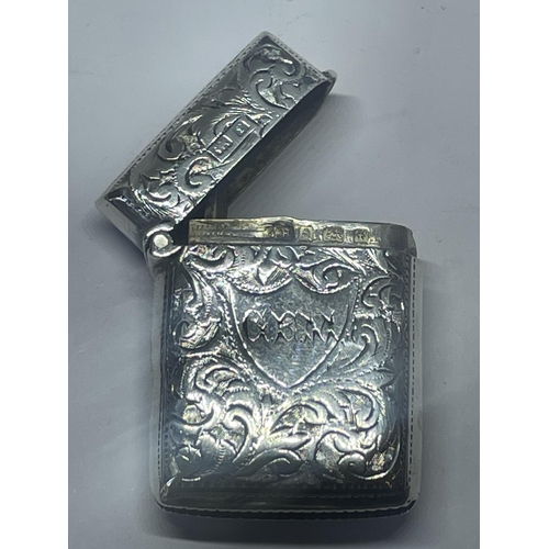 523 - A DECORATIVE HALLMARKED BIRMINGHAM SILVER VESTA CASE