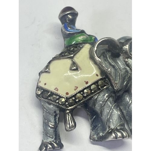 532 - A 1940'S SILVER, ENAMEL AND MARCASITE ELEPHANT AND RIDER BROOCH