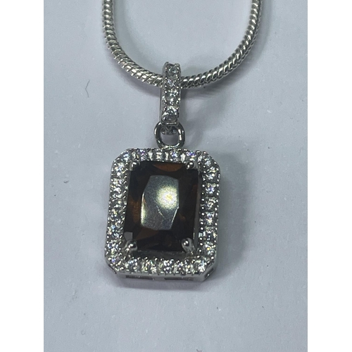 548 - A MARKED 925 SILVER NECKLACE WITH AMBER COLOURED STONE PENDANT SURROUNDED BY CLEAR STONES