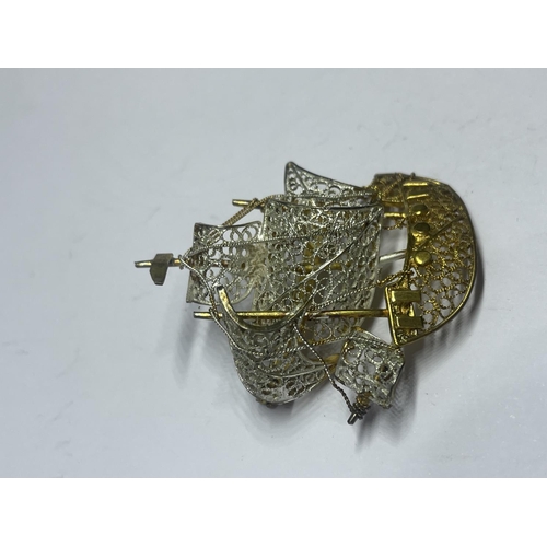 557 - A MARKED 800 SILVER AND SILVER GILT GALLEON  BROOCH