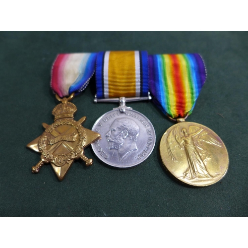 387 - A WORLD WAR I MEDAL TRIO AWARDED TO 1707 CORPORAL W H WHITWORTH WEST RIDING REGIMENT