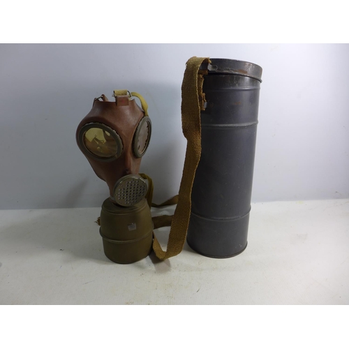 393 - A WORLD WAR II GAS MASK WITH METAL CONTAINER DATED 1939