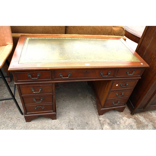 2700 - A MAHOGANY TWIN-PEDESTAL DESK ENCLOSING EIGHT DRAWERS WITH INSET LEATHER TOP, 48