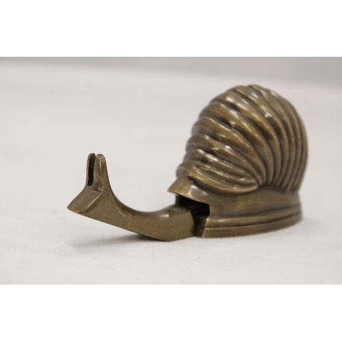 208 - A BRASS SNAIL TAPE MEASURE