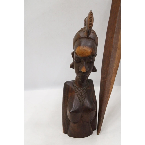 212 - AN AFRICAN CARVED WOODEN SCULPTURE OF A WOMAN'S HEAD PLUS A WOODEN AFRICAN STICK