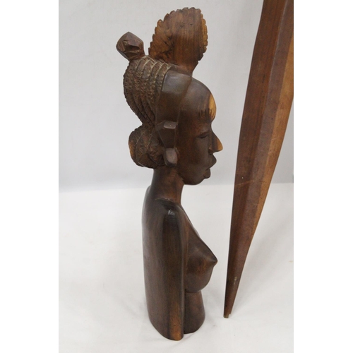 212 - AN AFRICAN CARVED WOODEN SCULPTURE OF A WOMAN'S HEAD PLUS A WOODEN AFRICAN STICK