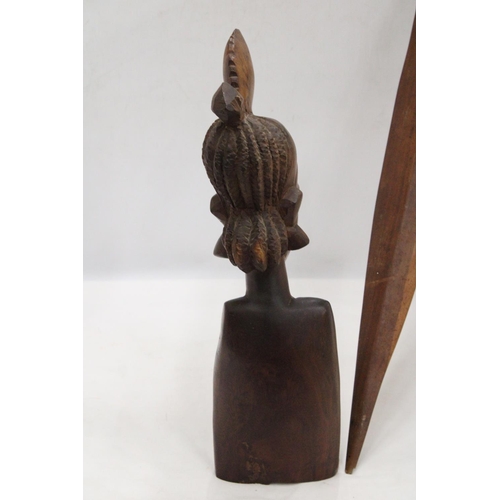 212 - AN AFRICAN CARVED WOODEN SCULPTURE OF A WOMAN'S HEAD PLUS A WOODEN AFRICAN STICK