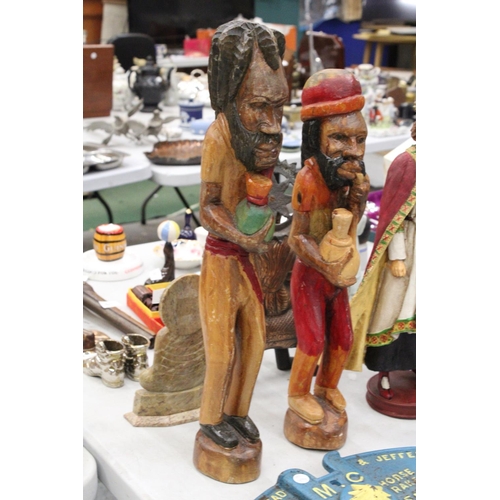 239 - TWO VINTAGE HAND CARVED, PAINTED WOODEN RASTA MEN - TALLEST APPROXIMATELY 57CM HIGH