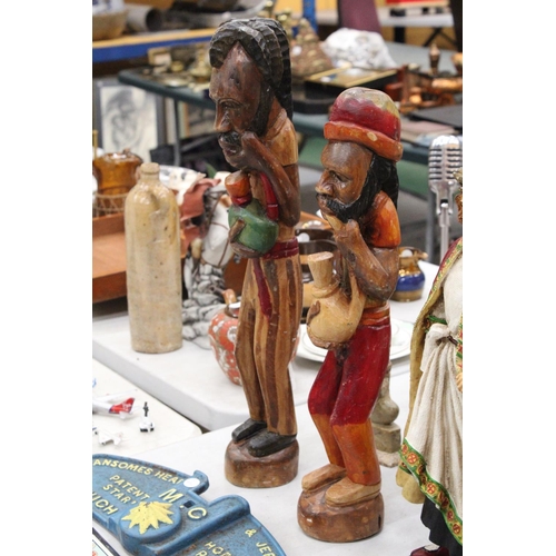 239 - TWO VINTAGE HAND CARVED, PAINTED WOODEN RASTA MEN - TALLEST APPROXIMATELY 57CM HIGH