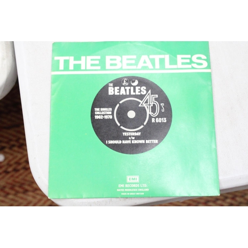 242 - THREE BEATLES SINGLES TO INCLUDE HEY JUDE, YESTERDAY AND ELEANOR RIGBY