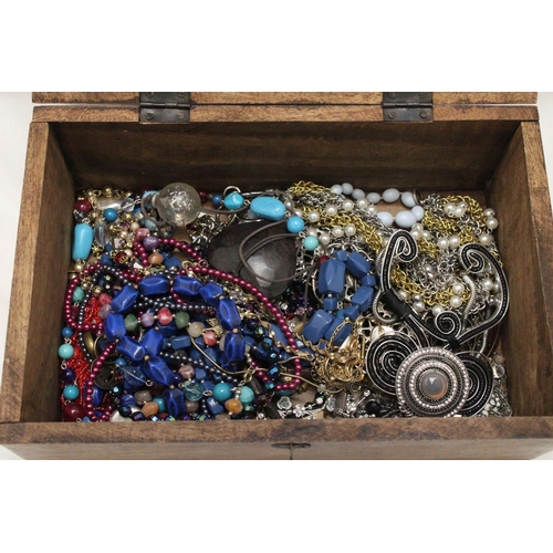 250 - A LARGE WOODEN CHEST FILLED WITH COSTUME JEWELLERY