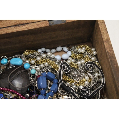 250 - A LARGE WOODEN CHEST FILLED WITH COSTUME JEWELLERY