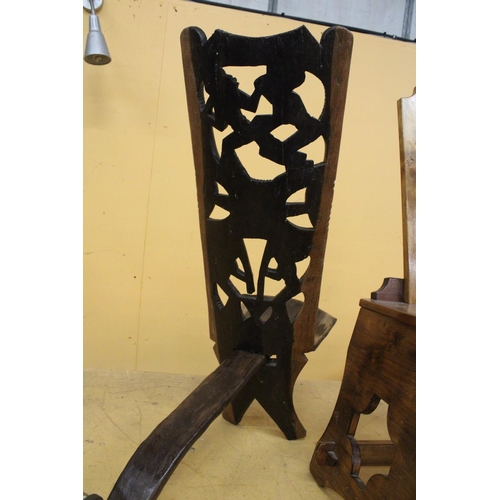 266 - A HAND CARVED AFRICAN CHAIR