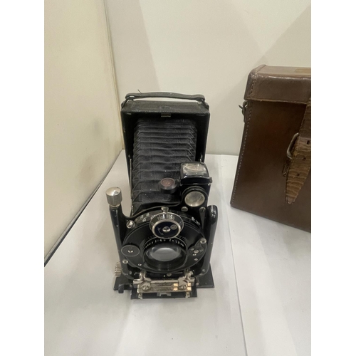 34 - A VINTAGE FOLD OUT CAMERA WITH CASE