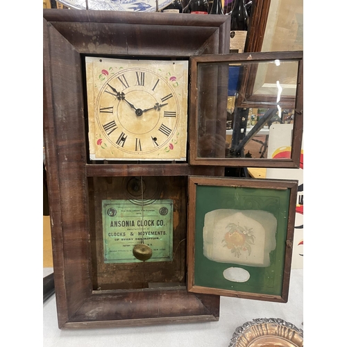 38 - AN ANSONIA CLOCK CO. DECORATIVE WALL CLOCK WITH A DECORATIVE FACE AND TWO GLASS DOORS ONE WITH PAINT... 
