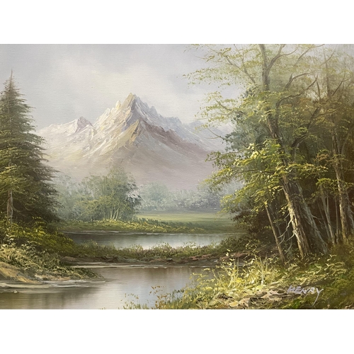 50 - A GILT FRAMED OIL ON BOARD OF A MOUNTAINOUS, WOODLAND, LAKE SCENE SIGNED TO THE RIGHT HAND CORNER HE... 