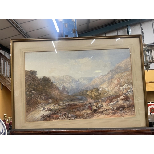 59 - A FRAMED WATERCOLOUR OF A MOUNTAINOUS RIVER SCENE WITH A SHEPHERD AND SHEPHERDESS WITH SHEEP SIGNED ... 