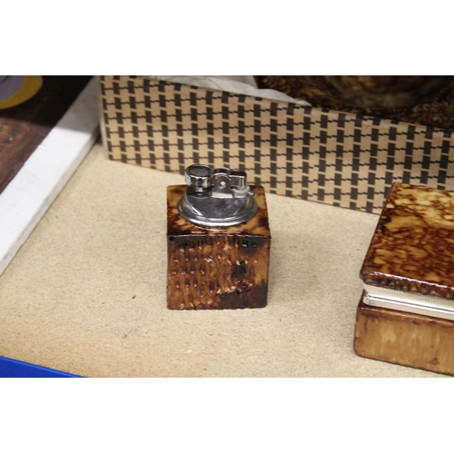 83 - A RESIN JEWELLERY BOX/CIGARETTE BOX TOGETHER WITH MATCHING LIGHTER AND ASHTRAY