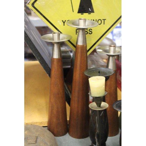 889 - A QUANTITY OF LARGE CANDLESTICKS TO INCLUDE TEAK WITH STAINLESS STEEL TOPS, WOOD, METAL PLUS A WAX M... 