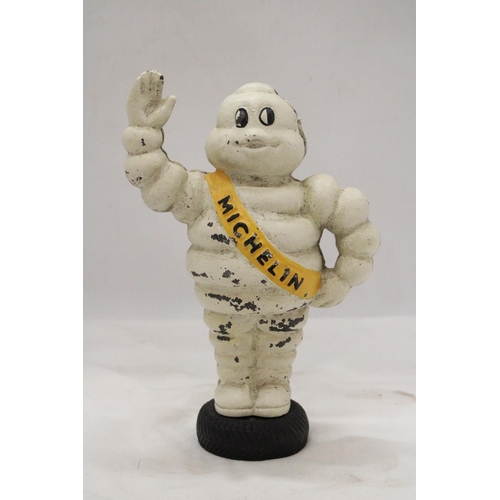 84 - A HEAVY CAST MODEL OF A MICHELIN MAN, HEIGHT 23CM