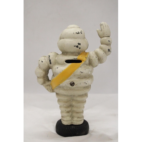 84 - A HEAVY CAST MODEL OF A MICHELIN MAN, HEIGHT 23CM