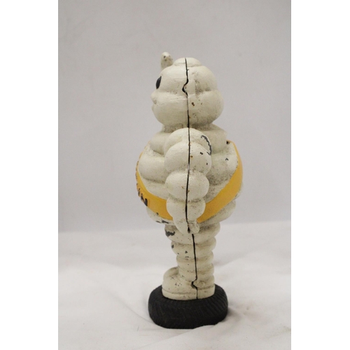 84 - A HEAVY CAST MODEL OF A MICHELIN MAN, HEIGHT 23CM