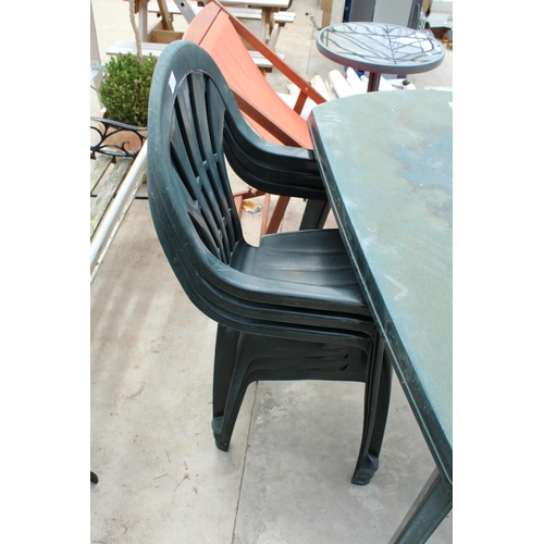 1763 - A PLASTIC GARDEN TABLE AND THREE PLASTIC STACKIBNG CHAIRS